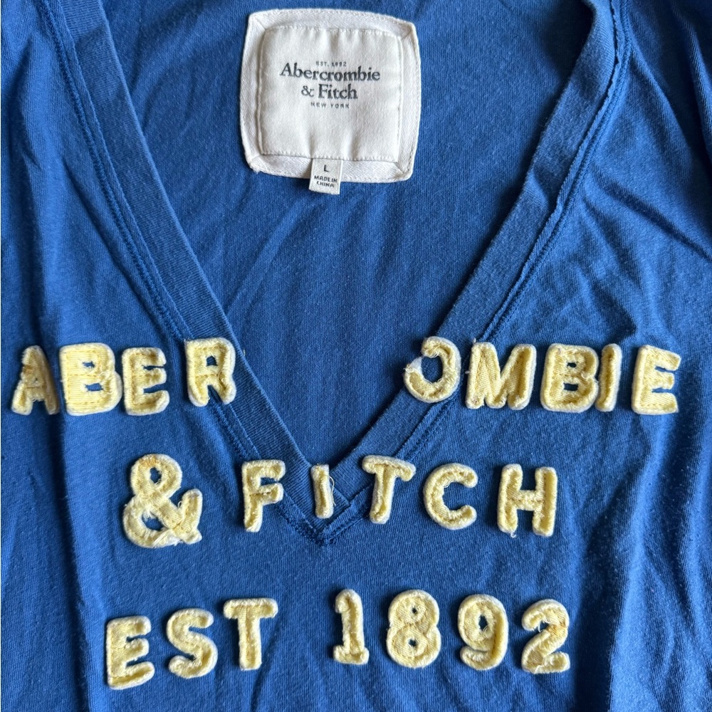2/$35 Y2K Abercrombie & Fitch Blue V-Neck Tee with Yellow Lettering - Picture 2 of 3